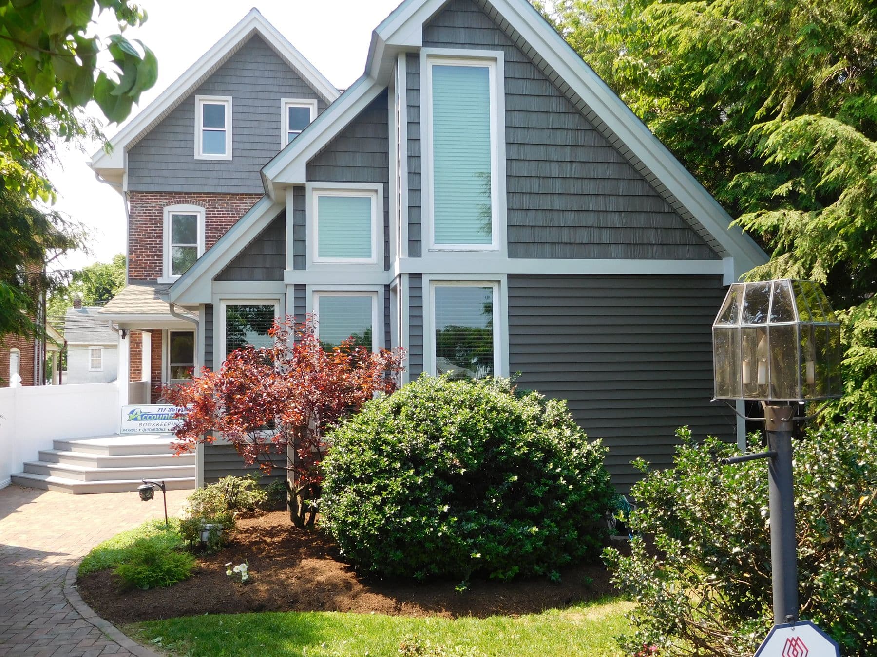Contemporary home with new large windows, shake siding and lap siding